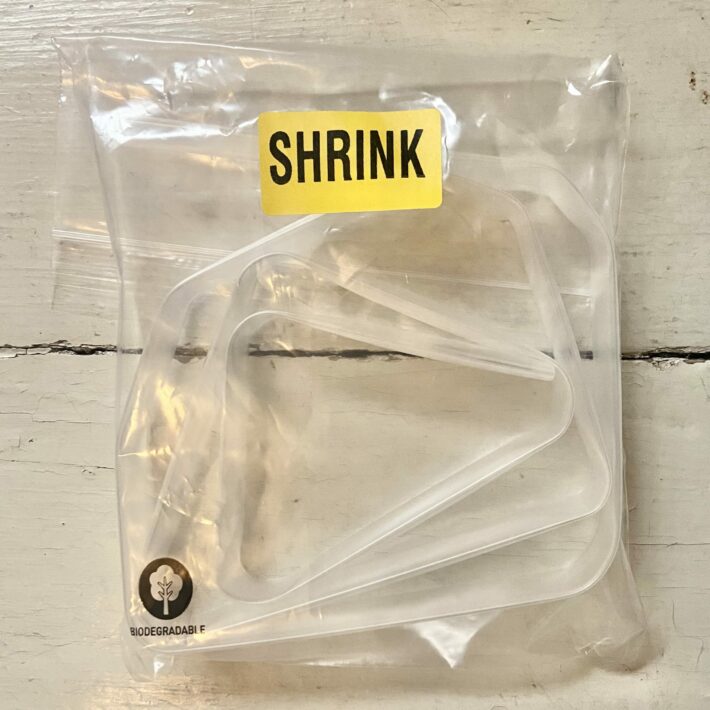 Lyon Shrink Sleeve clear plastic tubing rolled up on plastic bag