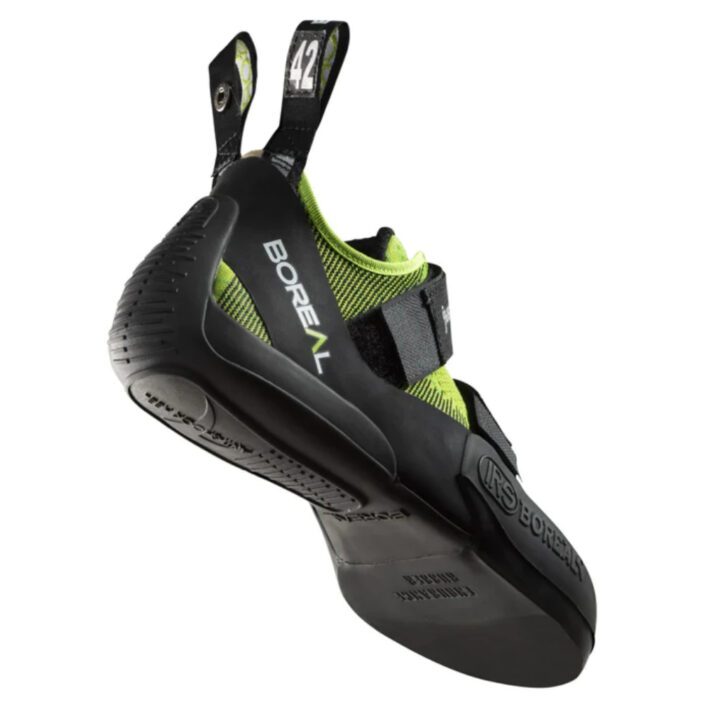 image shows the bottom and outside of climbing shoe with neon green fabric and black rubber